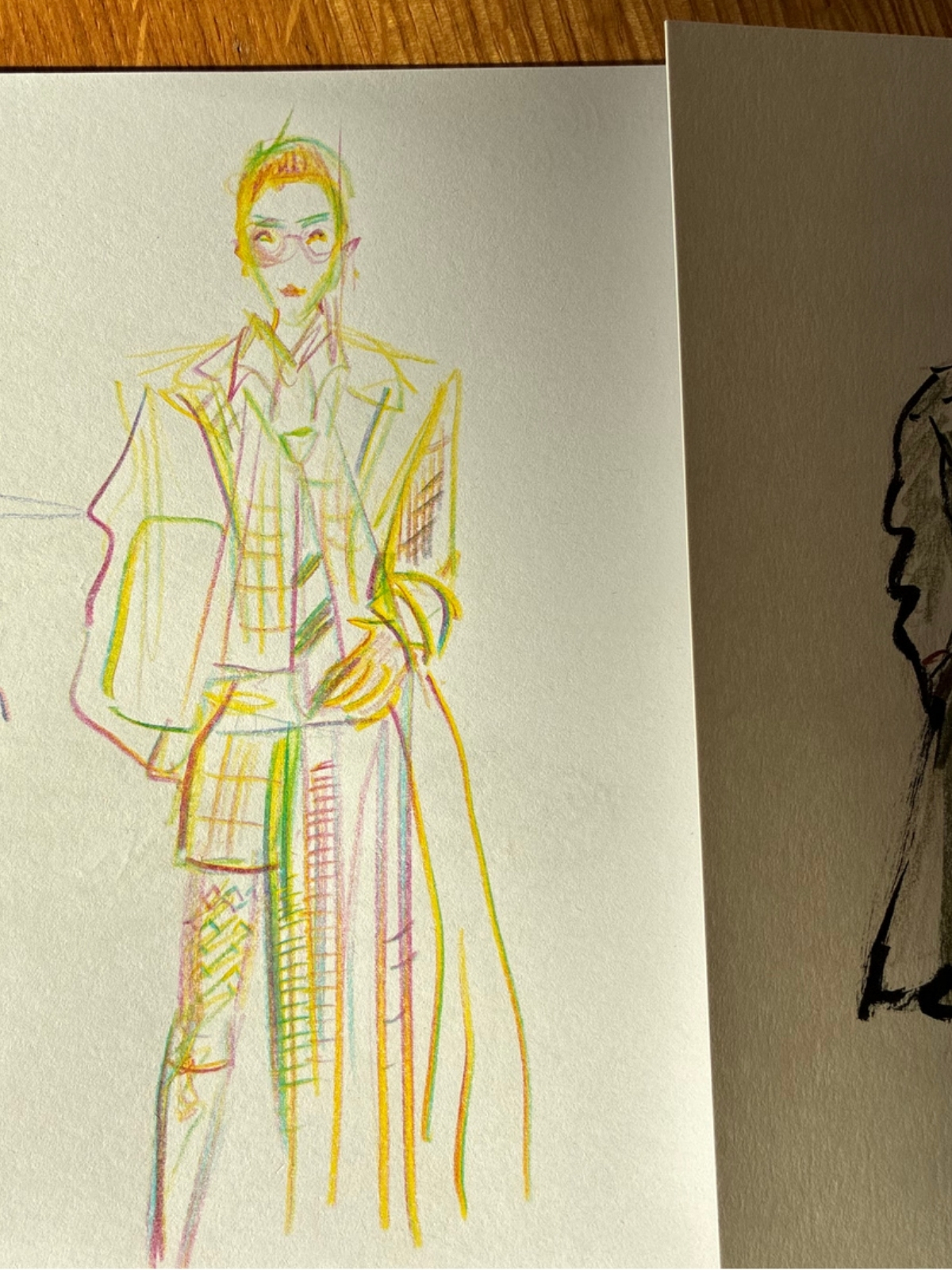Guest holding a finished live fashion illustration