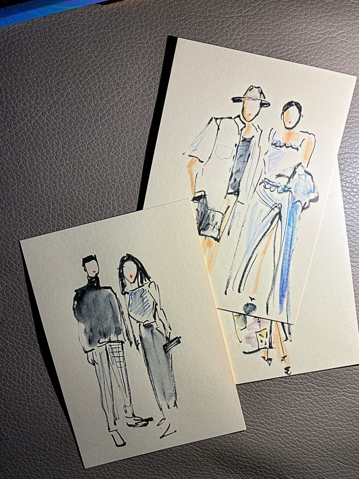 Two finished fashion sketches